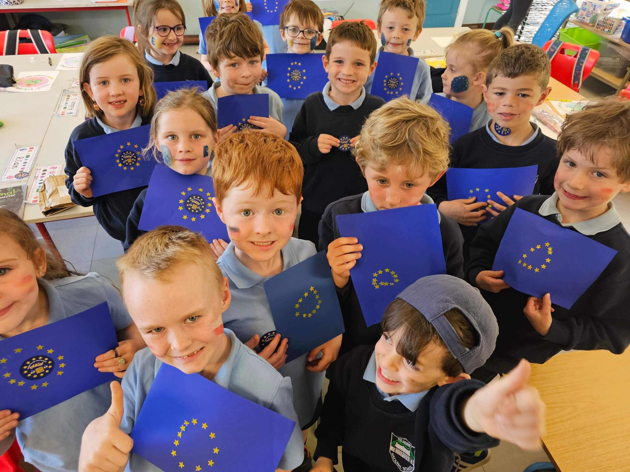 Primary school children display the EU flags they made